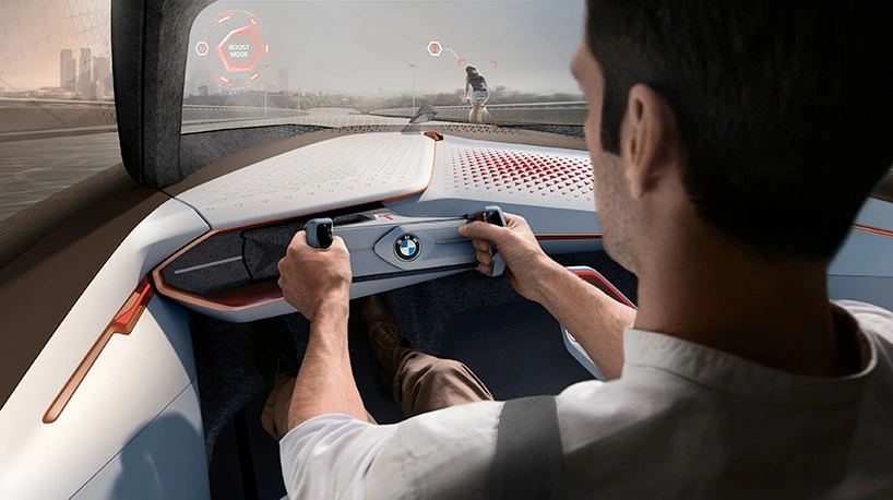 BMW Vision Next 100 - Interior futurista con tecnología adaptativa Interior del BMW Vision Next 100 mostrando el volante retráctil y el diseño minimalista del habitáculo