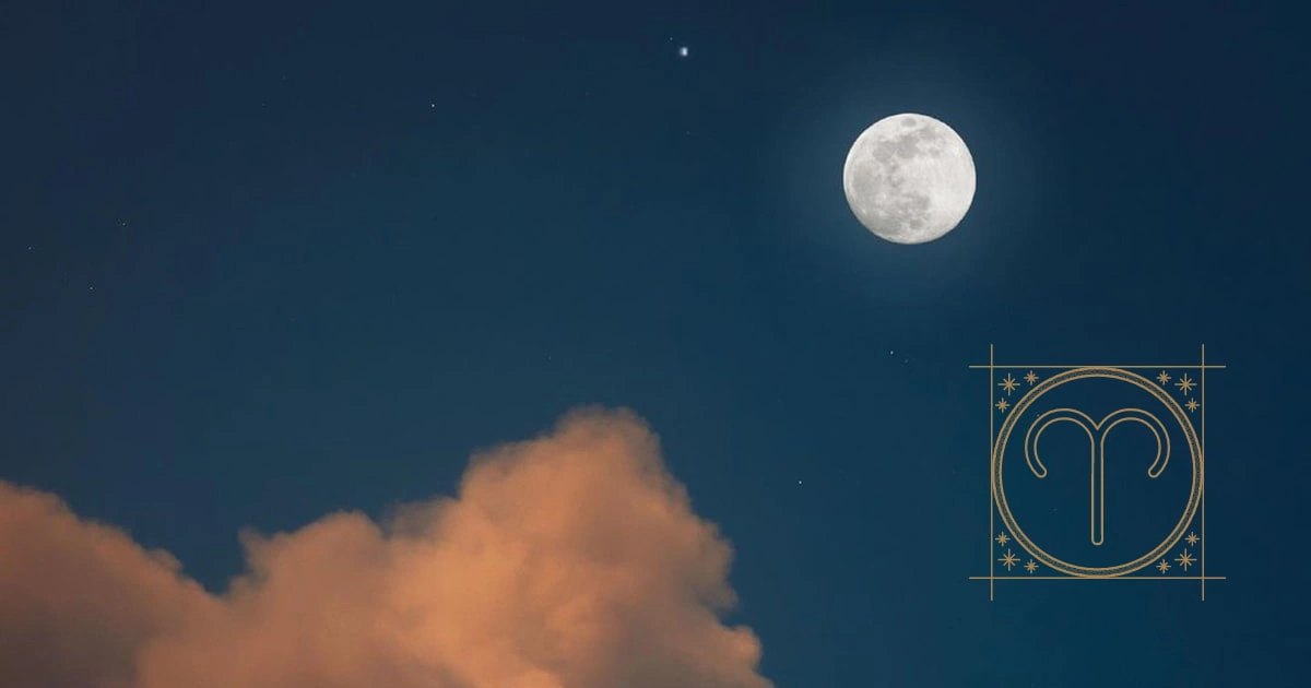 Imagen de la luna nueva en el cielo azul, con el signo de aires