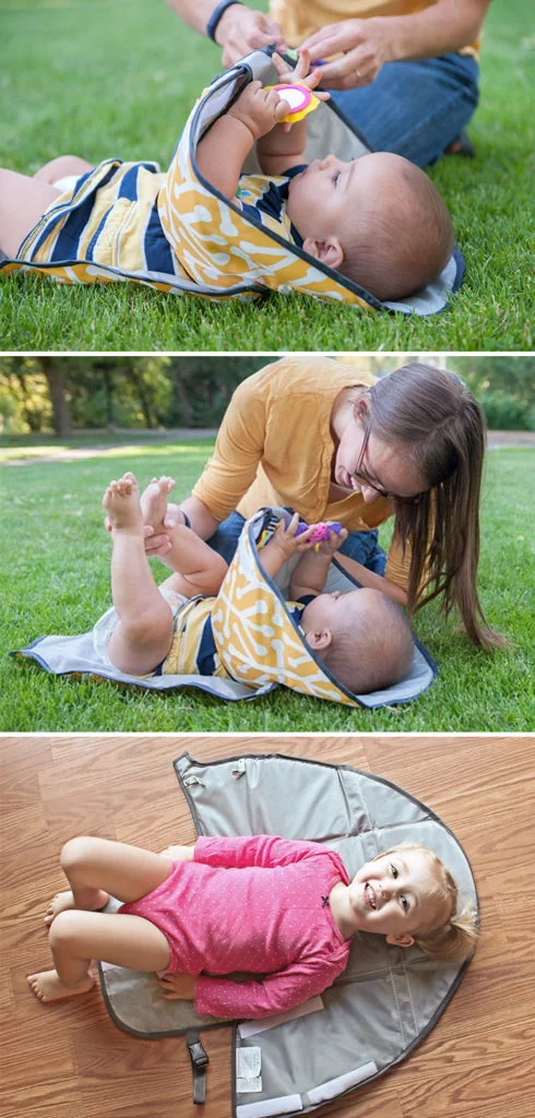 Cambiador de pañales portátil con barrera para mantener las manos del bebé ocupadas con juguetes, facilitando un cambio sin estrés.